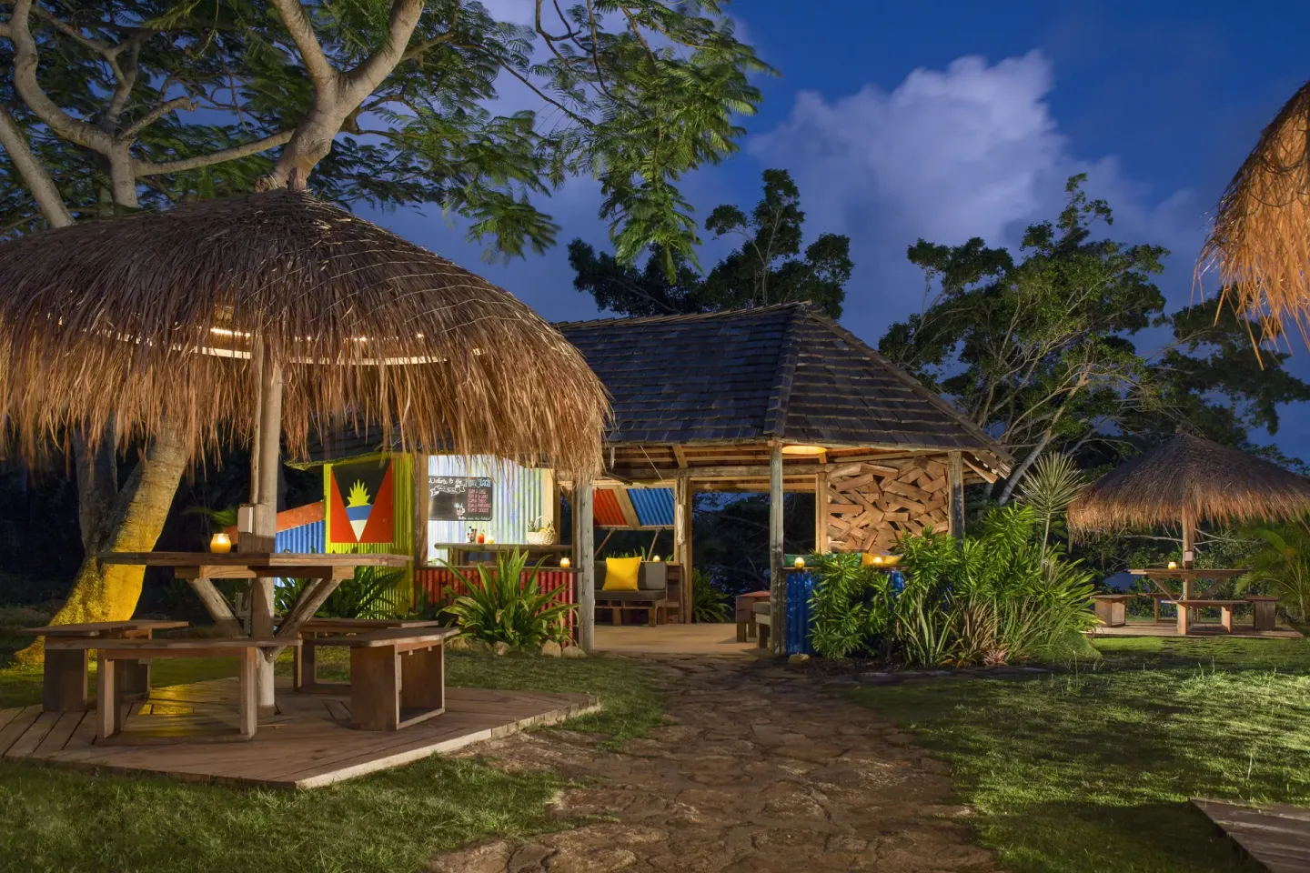 Thatched outdoor rum bar seating area at Galley Bay Resort & Spa.