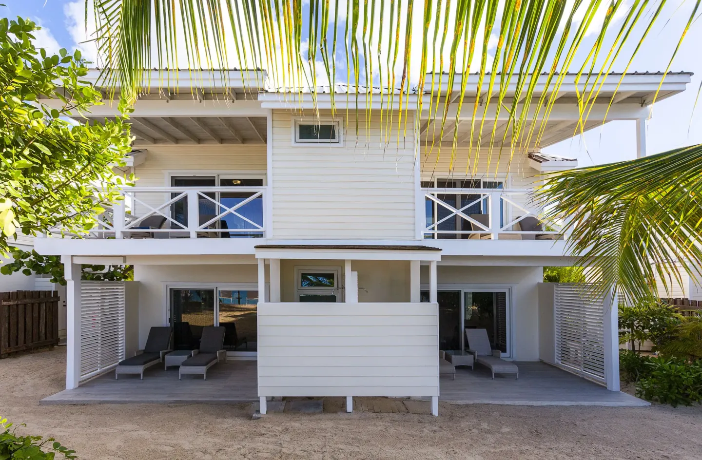 Deluxe Beachfront room building exterior with balconies at Galley Bay Resort & Spa.