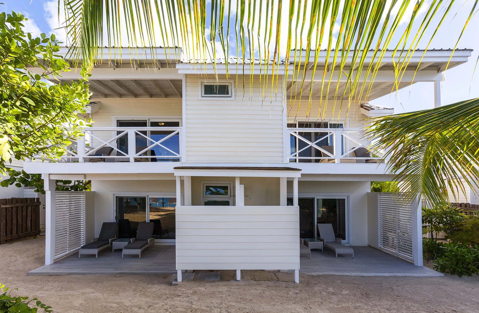 Deluxe Beachfront room building exterior with balconies at Galley Bay Resort & Spa.