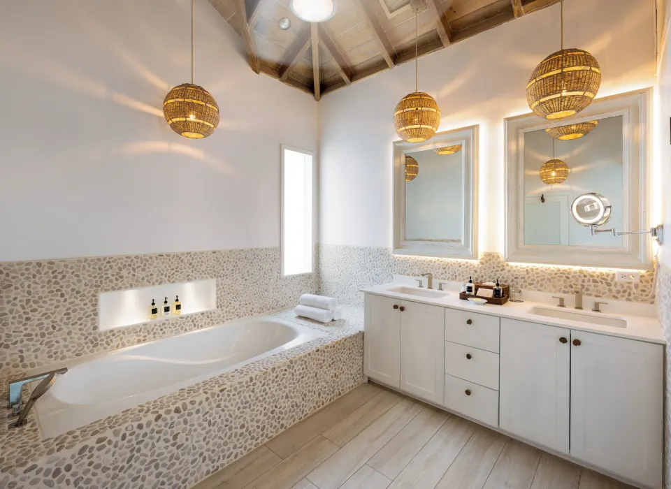 Premium Beachfront Suite bathroom with tub and vanity at Galley Bay Resort & Spa.