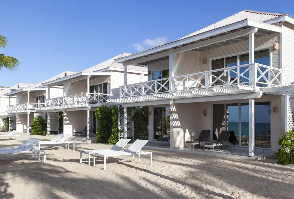 Premium Beachfront Suite row with balconies by the beach at Galley Bay Resort & Spa.