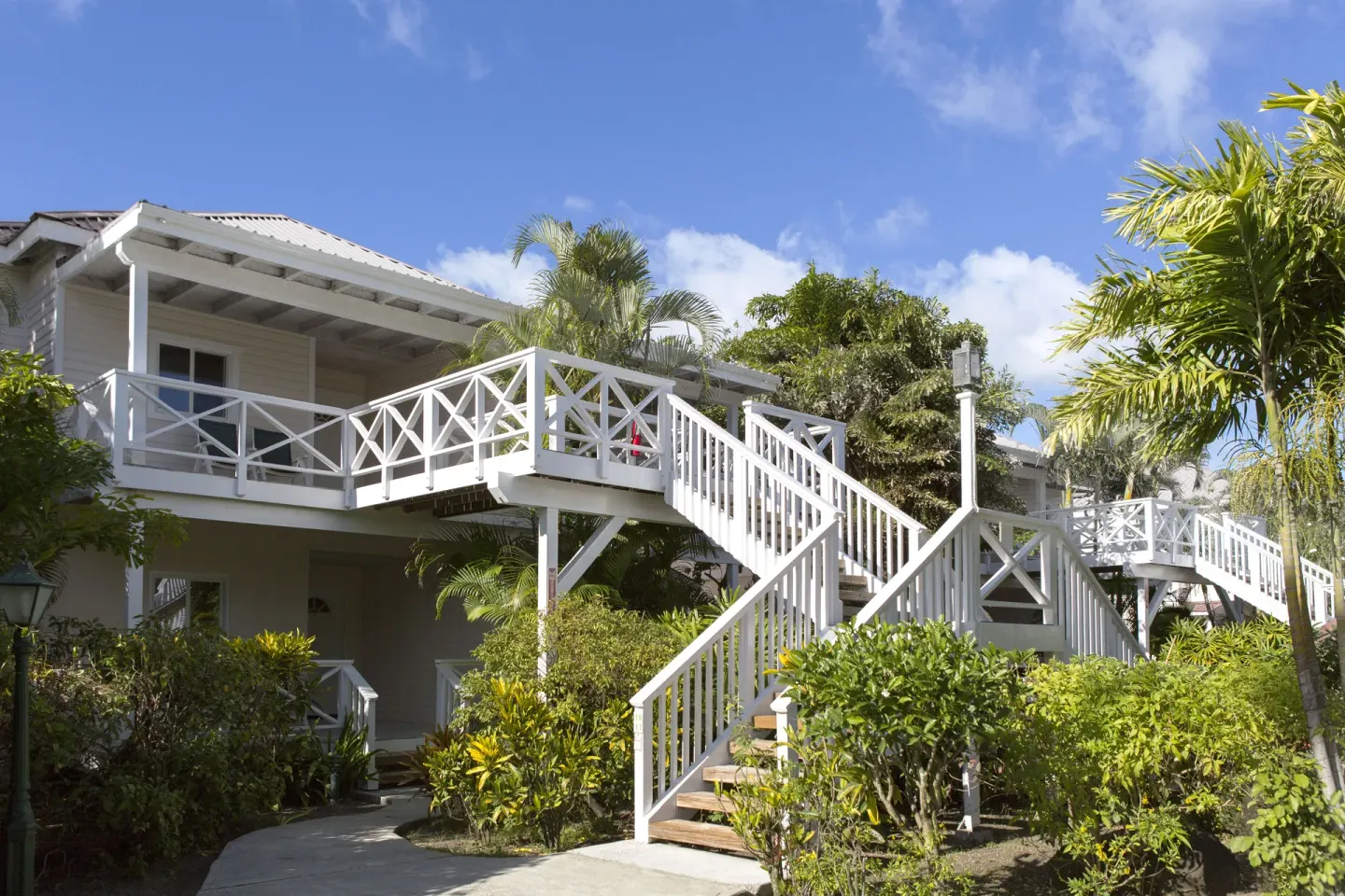 Premium Beachfront Suite staircase and garden exterior at Galley Bay Resort & Spa.
