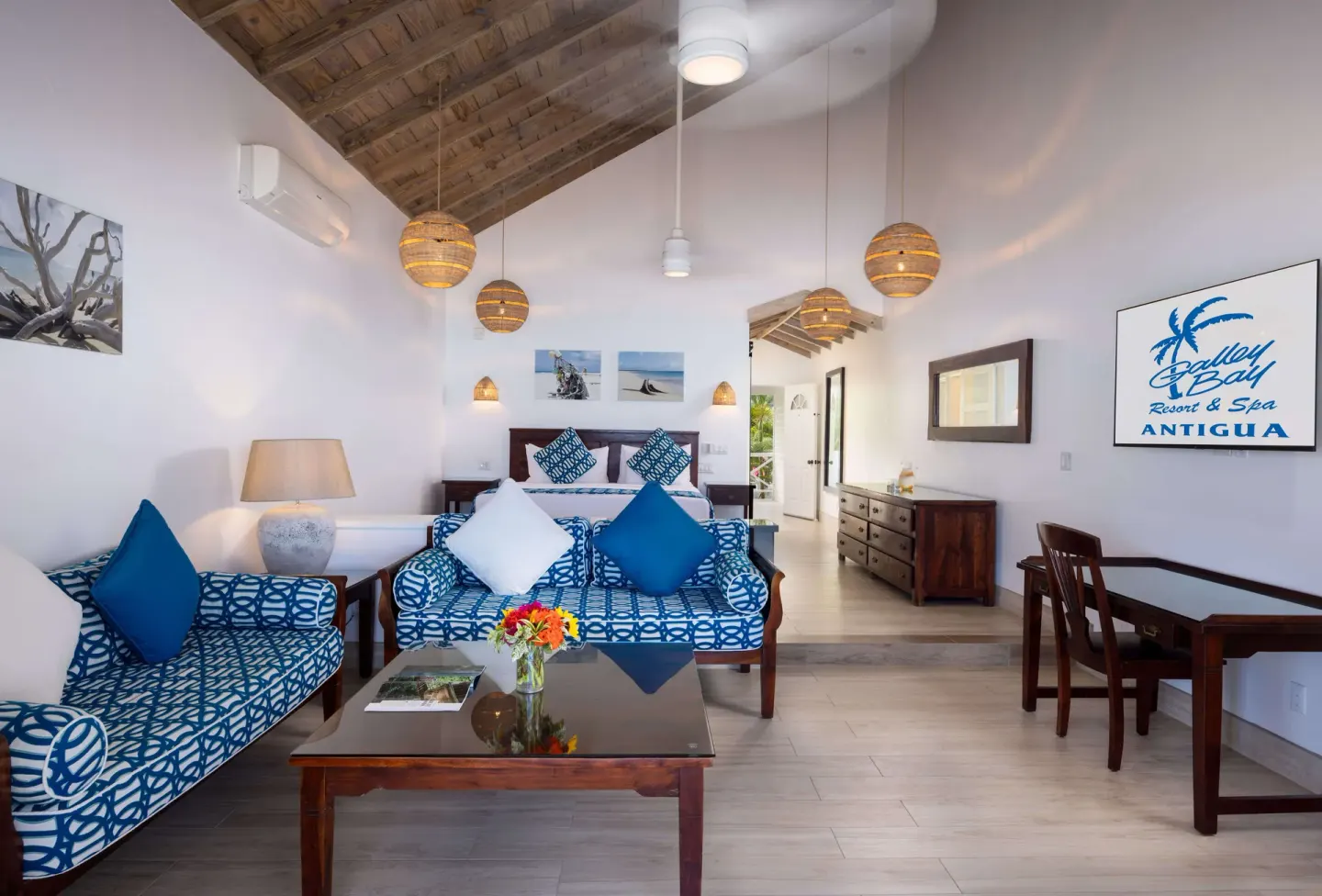 Premium Beachfront Suite living area and bed at Galley Bay Resort & Spa.