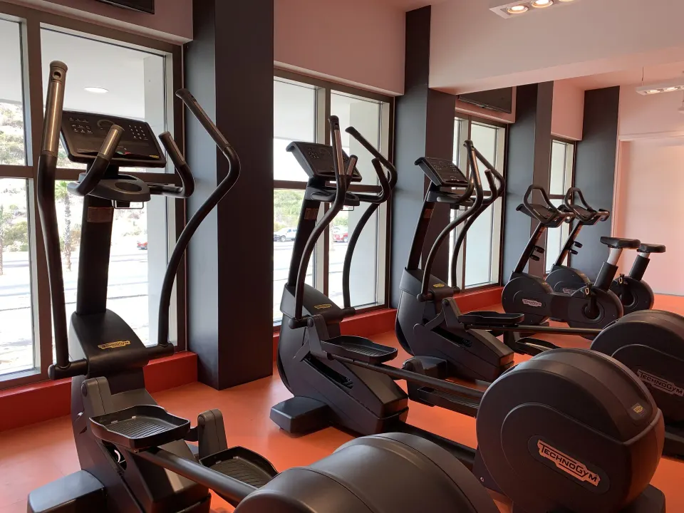 Ellipticals and exercise bikes by the windows at Garza Blanca Los Cabos.