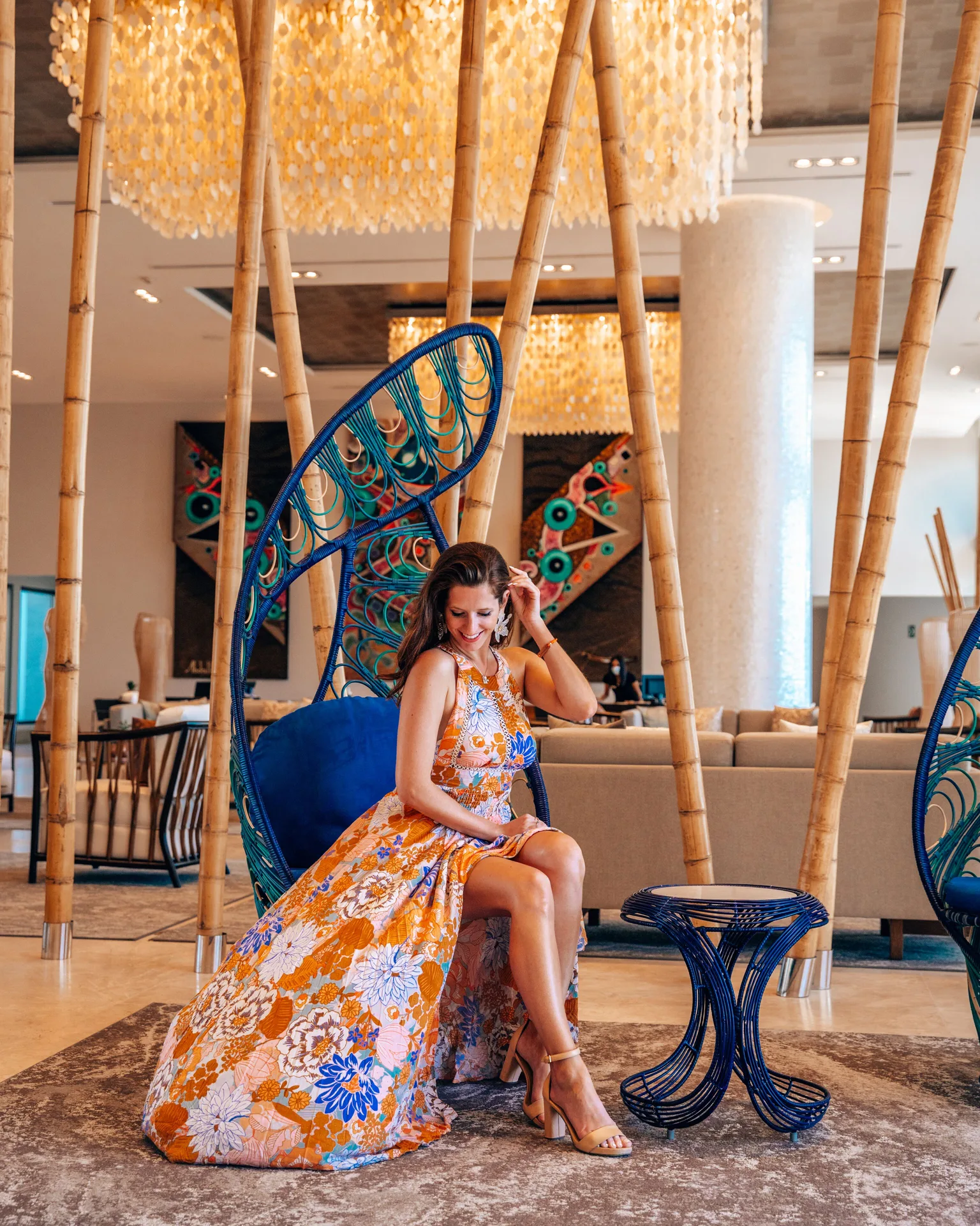 Lobby seating with bamboo accents and blue chair at Garza Blanca Los Cabos.