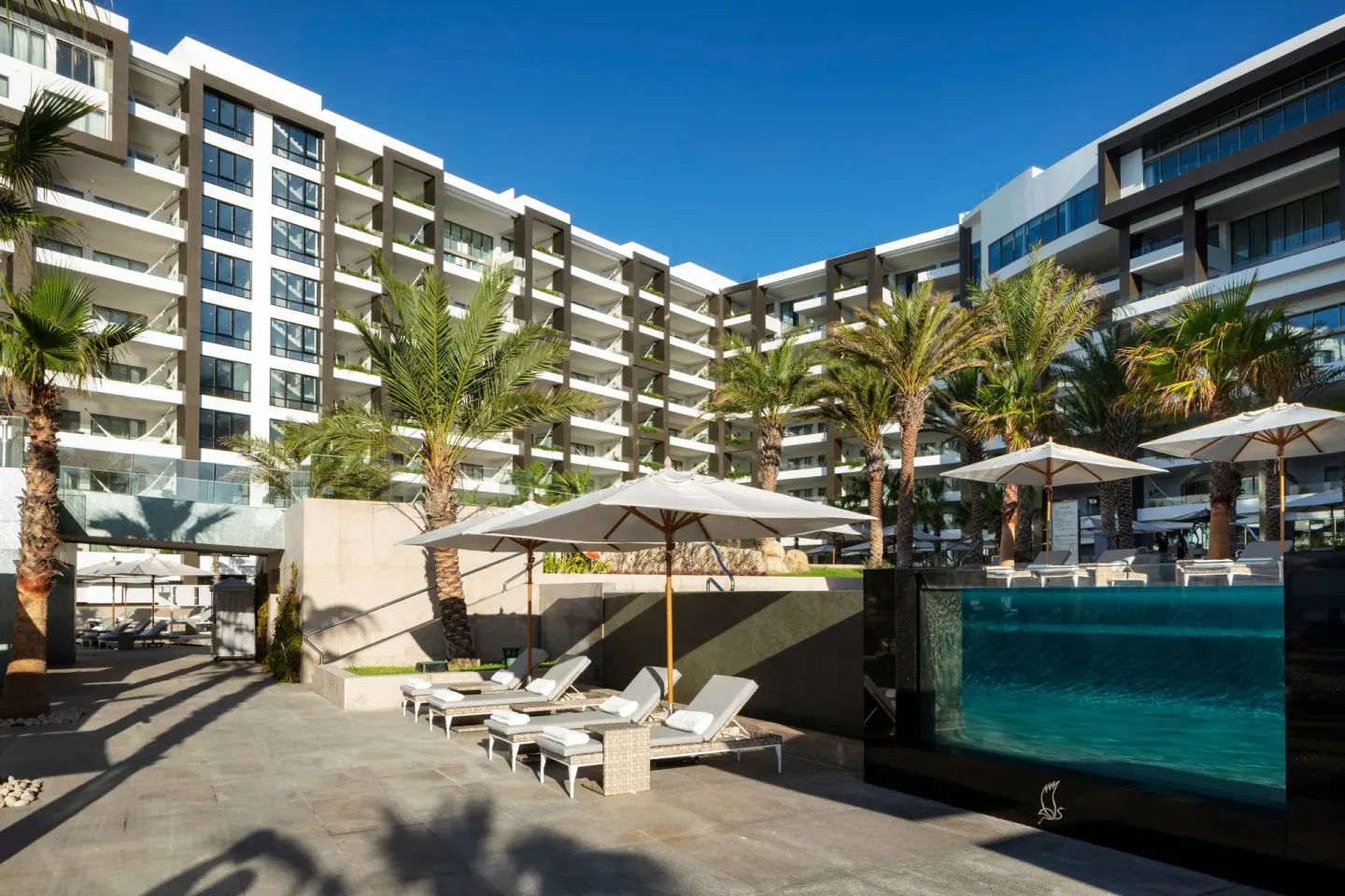 Resort buildings and raised pool terrace at Garza Blanca Los Cabos.