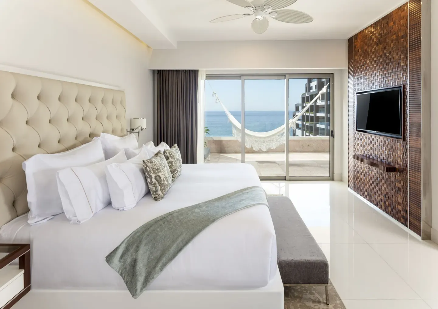 1 Bedroom Ocean View bedroom with king bed and balcony hammock at Garza Blanca Los Cabos.