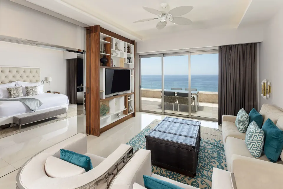 1 Bedroom Ocean View living room with bedroom alcove and ocean balcony at Garza Blanca Los Cabos.