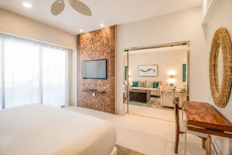 King bedroom in the 2 Bedroom Suite King at Garza Blanca Los Cabos looking into the living room.