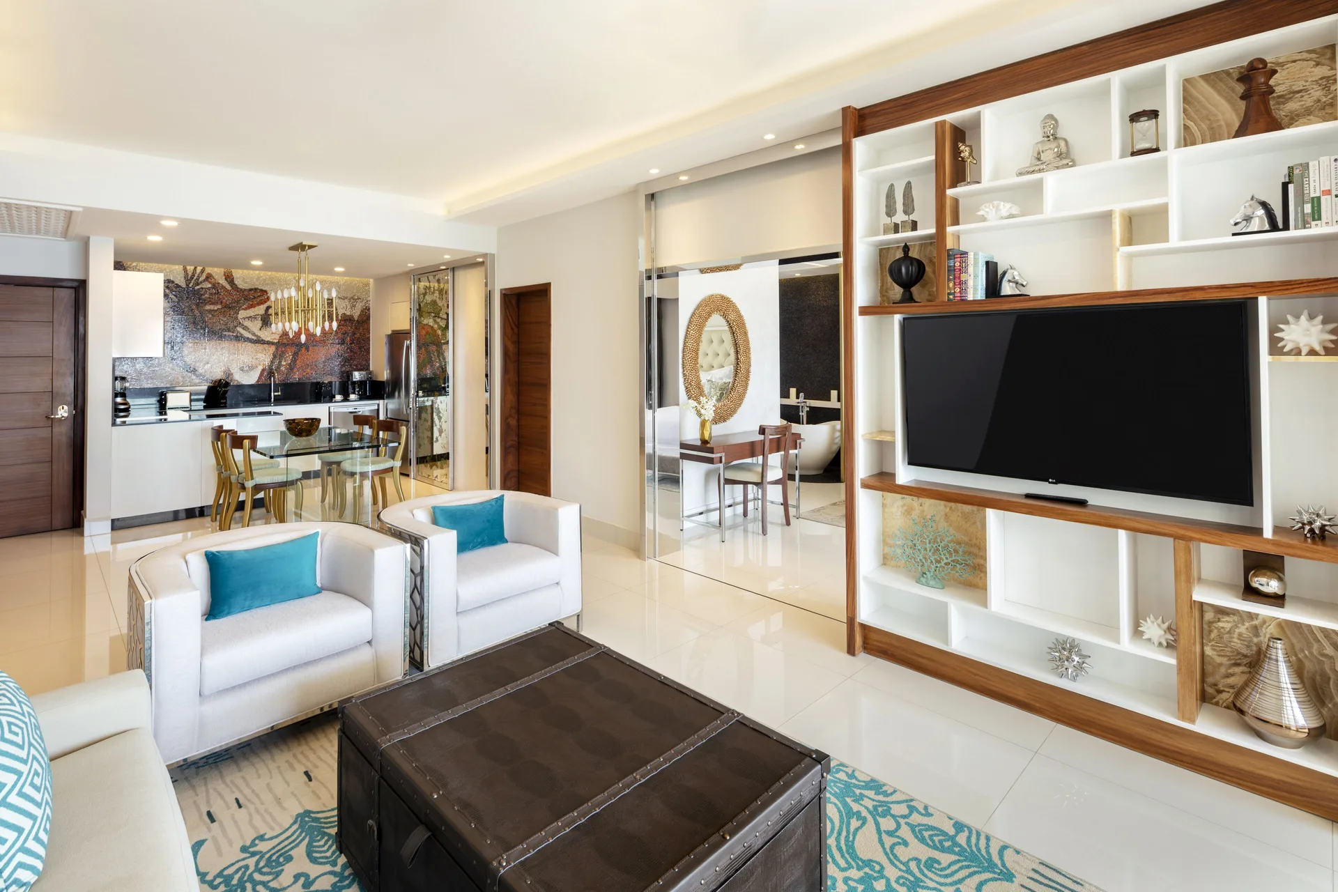 Open living and dining area in the 2 Bedroom Suite King at Garza Blanca Los Cabos with TV shelving.