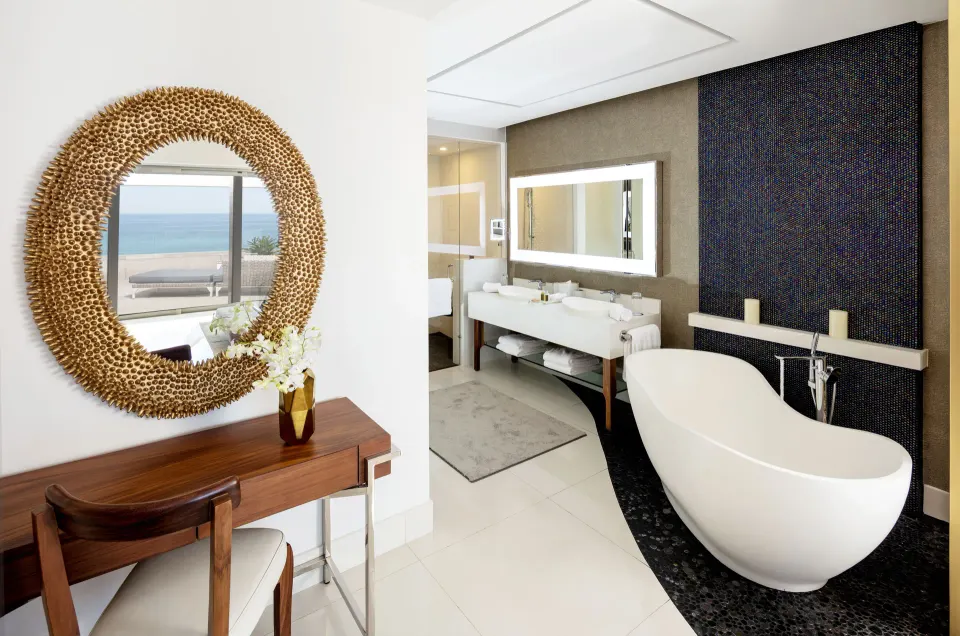 Ocean-view bathroom in a 4 Bedroom Loft at Garza Blanca Los Cabos with soaking tub and vanity.
