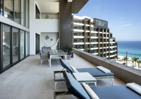 Four Bedroom Loft Ocean View terrace with loungers and ocean beyond at Garza Blanca Los Cabos.