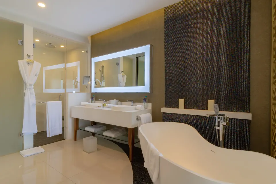 Junior Suite Ocean View bathroom with soaking tub and double vanity at Garza Blanca Los Cabos.