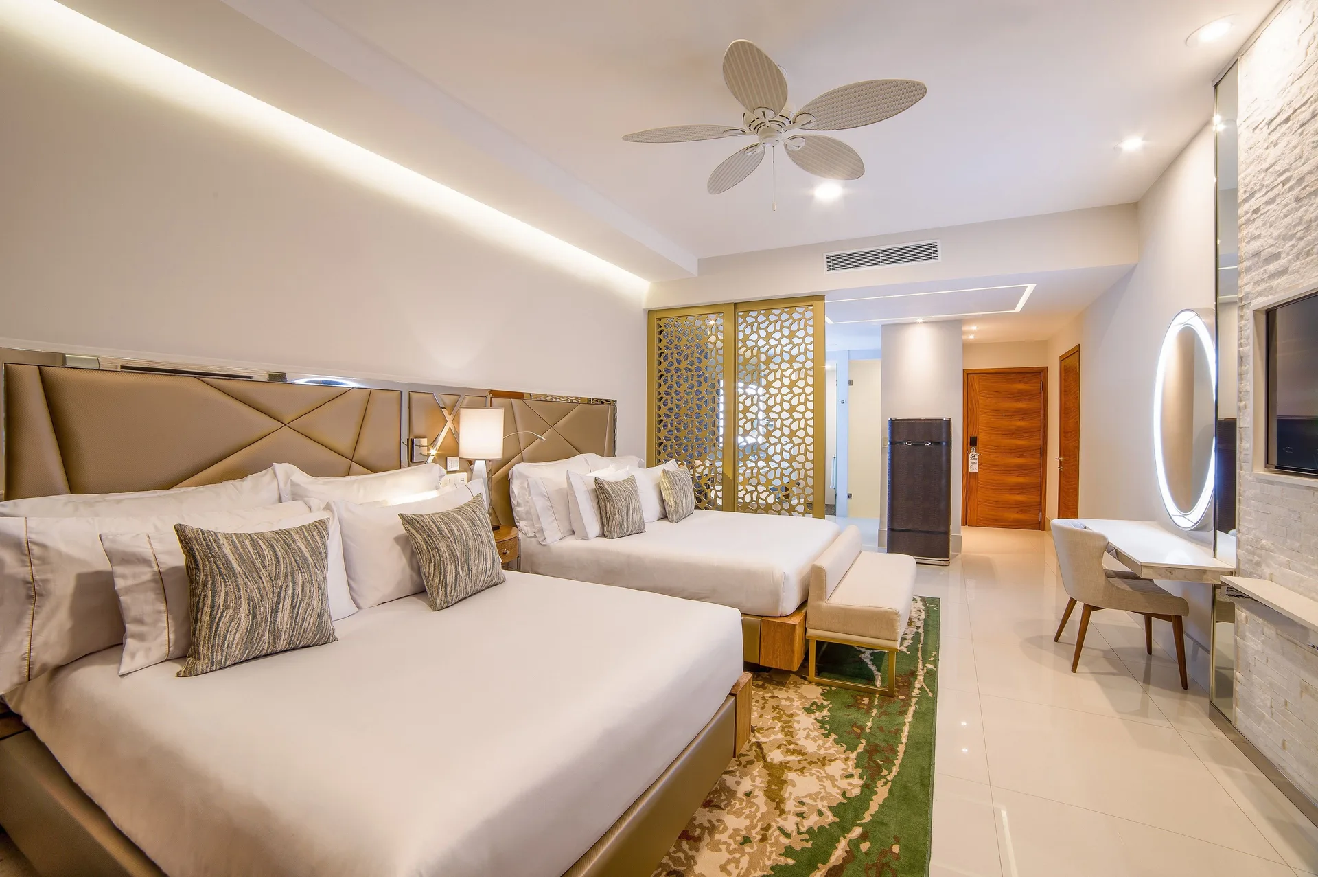 Junior Suite Ocean View with two queen beds and vanity at Garza Blanca Los Cabos.