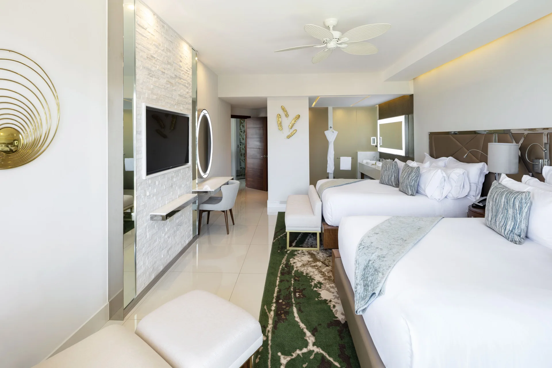 Junior Suite Ocean View two beds with TV wall and open bathroom at Garza Blanca Los Cabos.