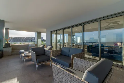 Covered terrace seating outside the suite at Garza Blanca Los Cabos.