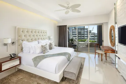 King bedroom with terrace hammock in a 3 Bedroom Suite at Garza Blanca Los Cabos.