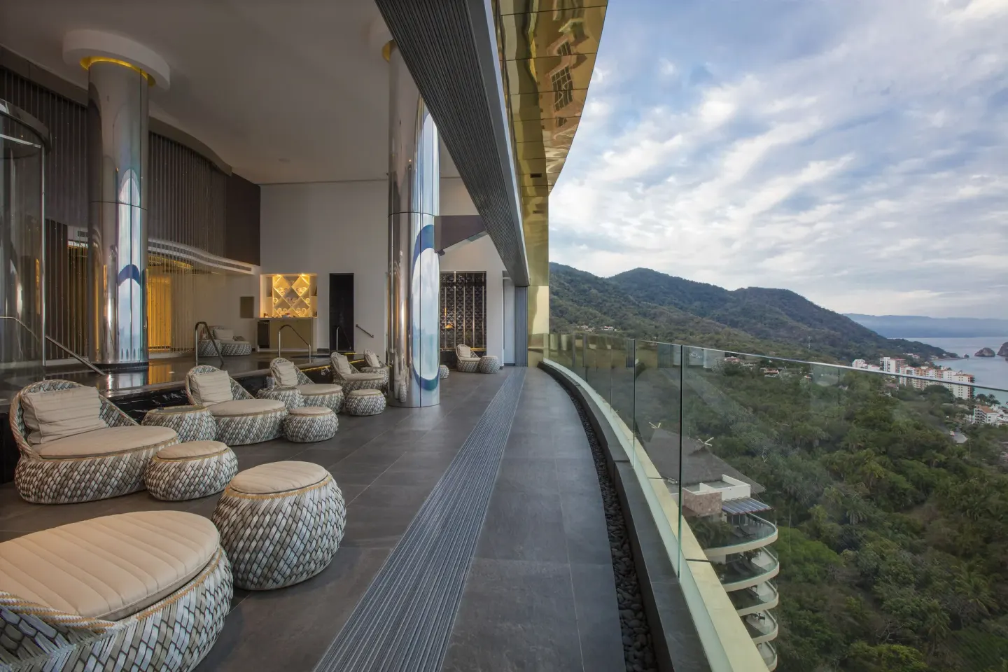 Elevated lounge terrace with mountain and ocean views at Garza Blanca Preserve Resort & Spa.
