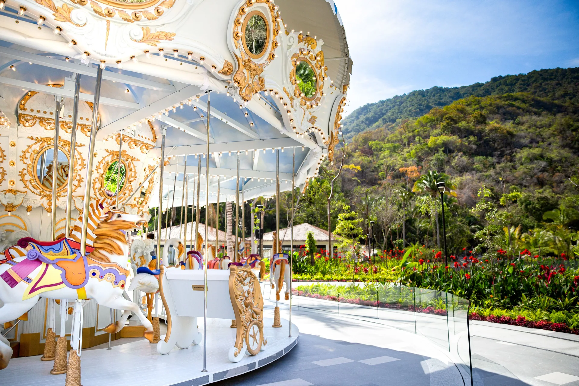 Carousel with ornate horses in the gardens at Garza Blanca Preserve Resort & Spa.