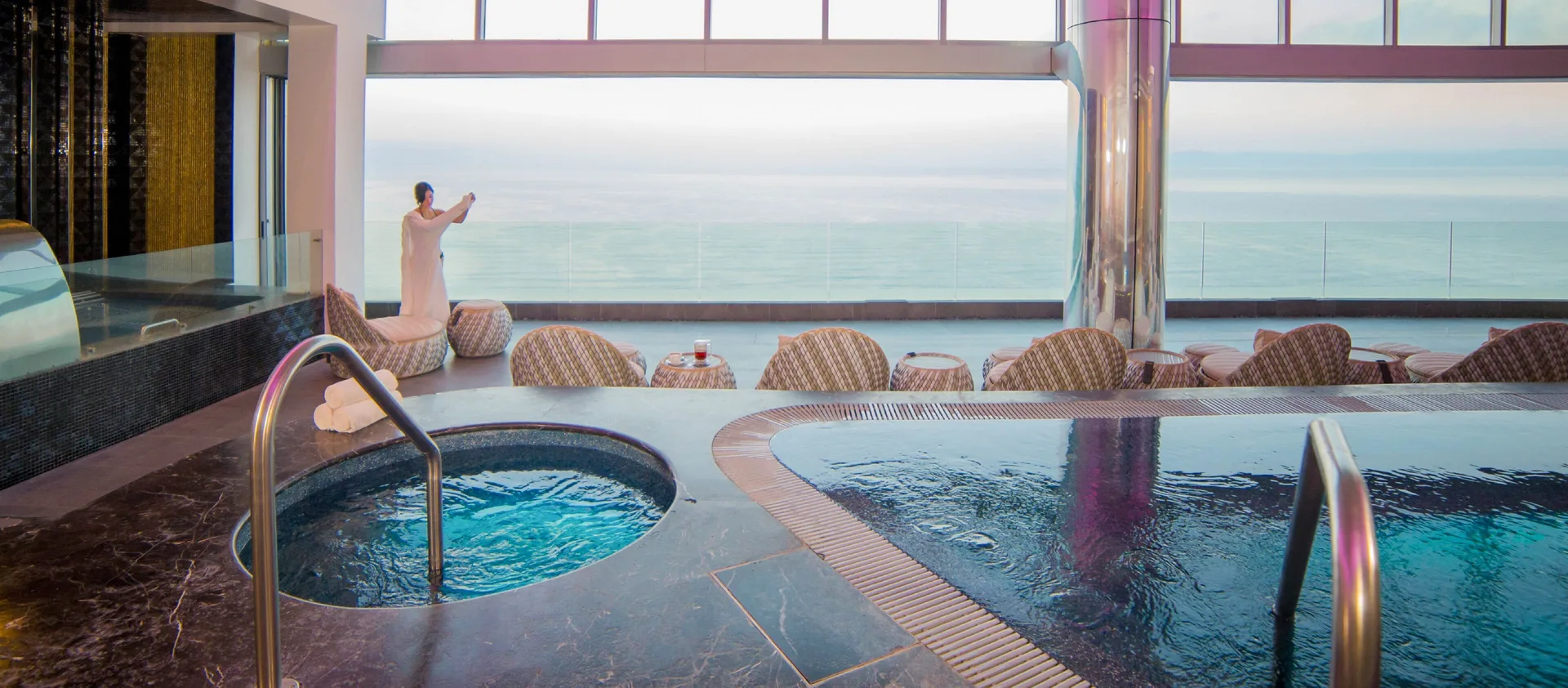 Indoor spa pools with oceanfront windows at Garza Blanca Preserve Resort & Spa.