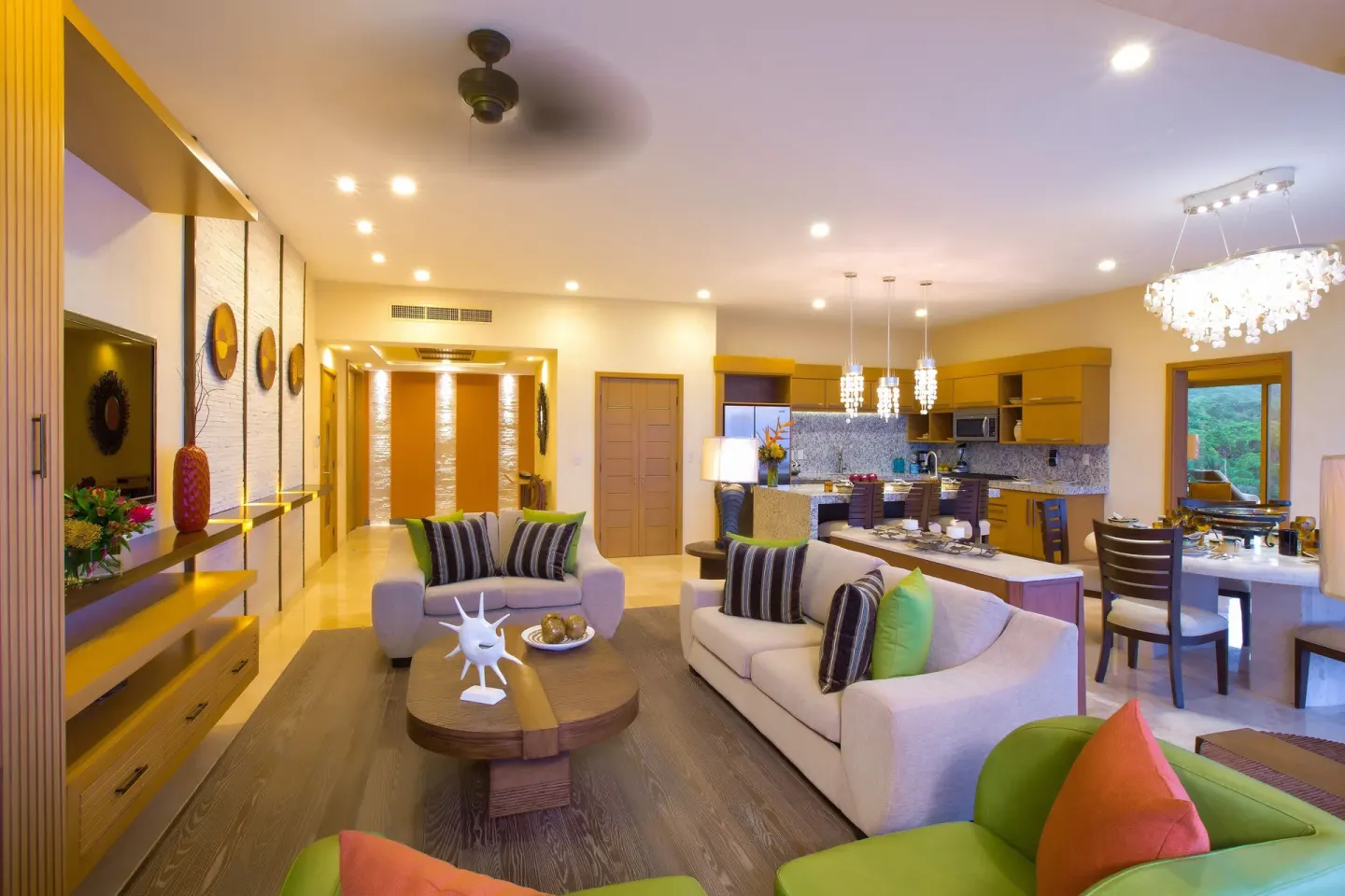 Spacious suite living room with kitchen and dining area at Garza Blanca Preserve Resort & Spa.