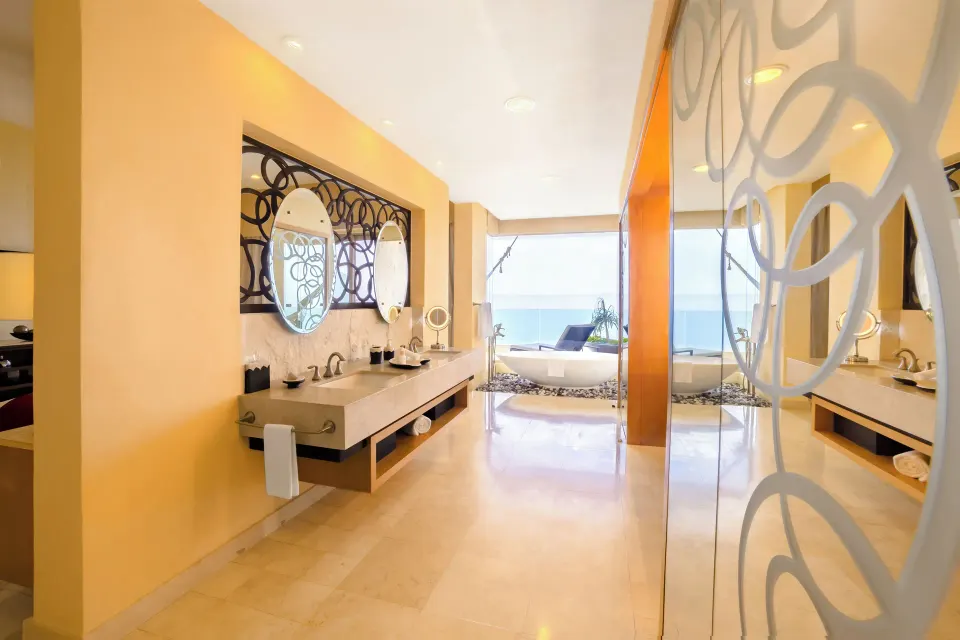 Bathroom vanity and tub in a 2 Bedroom Suite Panoramic at Garza Blanca Preserve Resort & Spa.