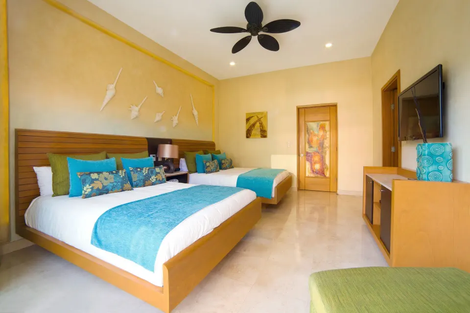 Two-bed guest room in a 2 Bedroom Suite Panoramic at Garza Blanca Preserve Resort & Spa.