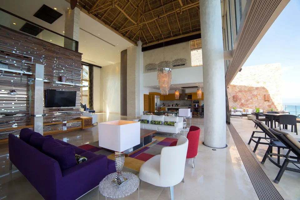 Living room and terrace in the 3 Bedroom Suite Ocean Front at Garza Blanca Preserve Resort & Spa.