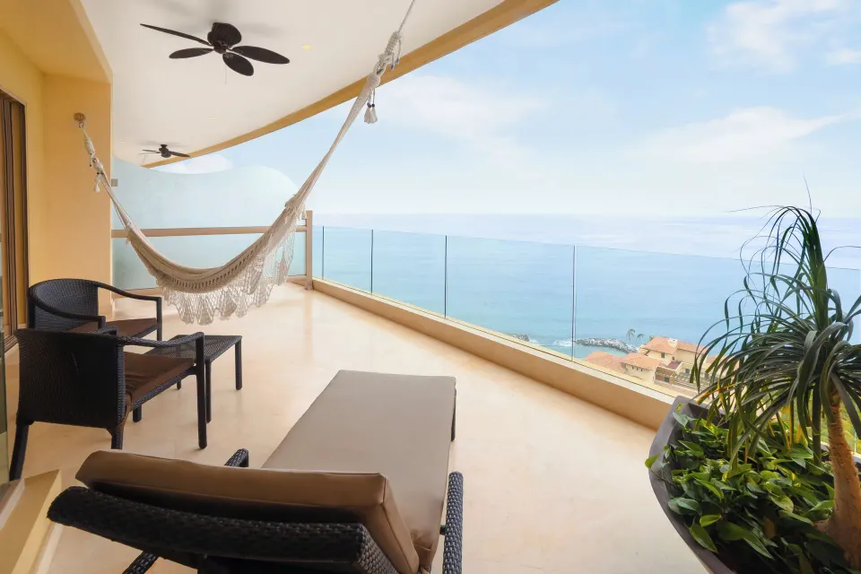 Junior Panoramic Suite balcony with hammock and ocean view at Garza Blanca Preserve Resort & Spa.