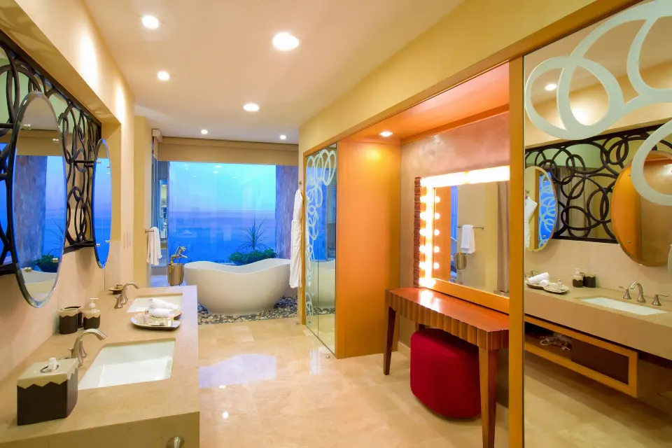Junior Panoramic Suite bathroom with tub and vanity at Garza Blanca Preserve Resort & Spa.