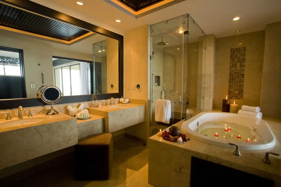 Oceanfront Penthouse bathroom with soaking tub and glass shower at Garza Blanca Preserve Resort & Spa.