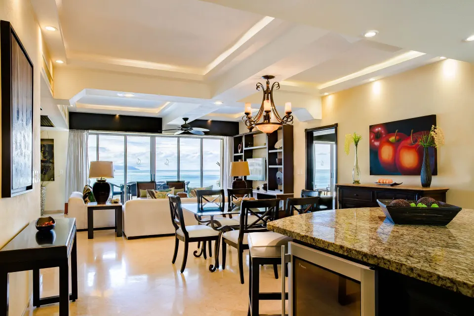 Oceanfront Penthouse dining and kitchen area at Garza Blanca Preserve Resort & Spa with ocean beyond.
