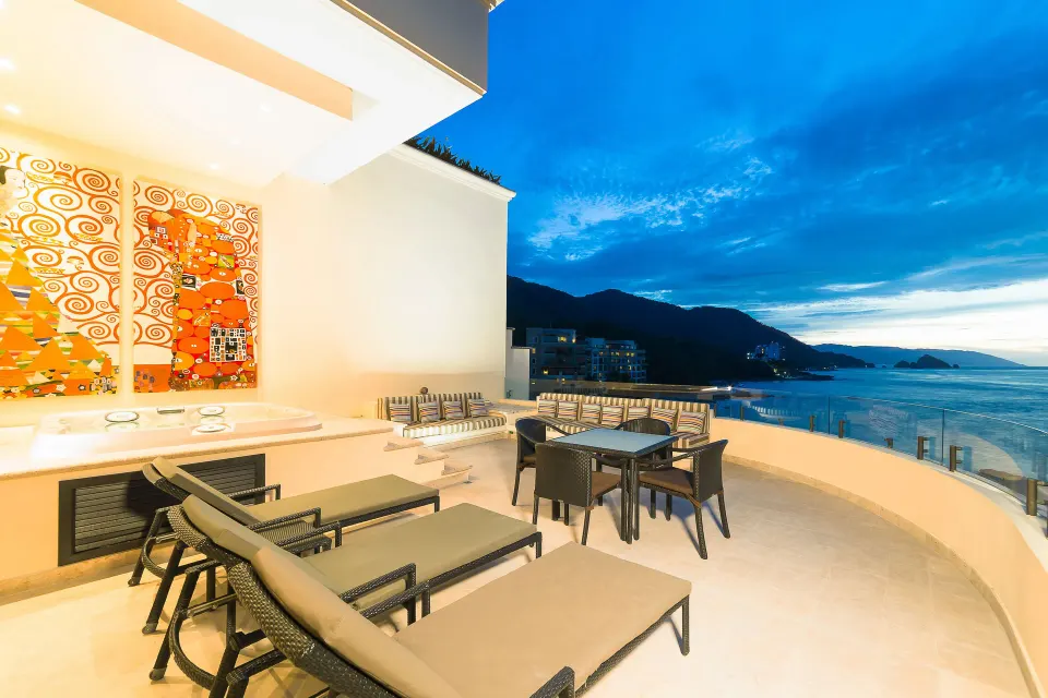 Oceanfront Penthouse terrace with loungers and ocean view at Garza Blanca Preserve Resort & Spa.