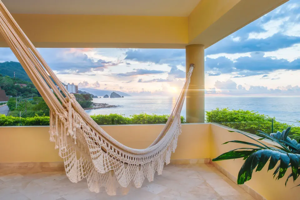 Honeymoon Suite balcony hammock with ocean view at Garza Blanca Preserve Resort & Spa.
