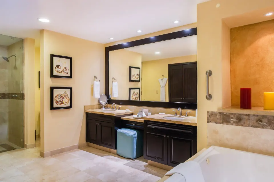 Honeymoon Suite bathroom with double vanity and soaking tub at Garza Blanca Preserve Resort & Spa.