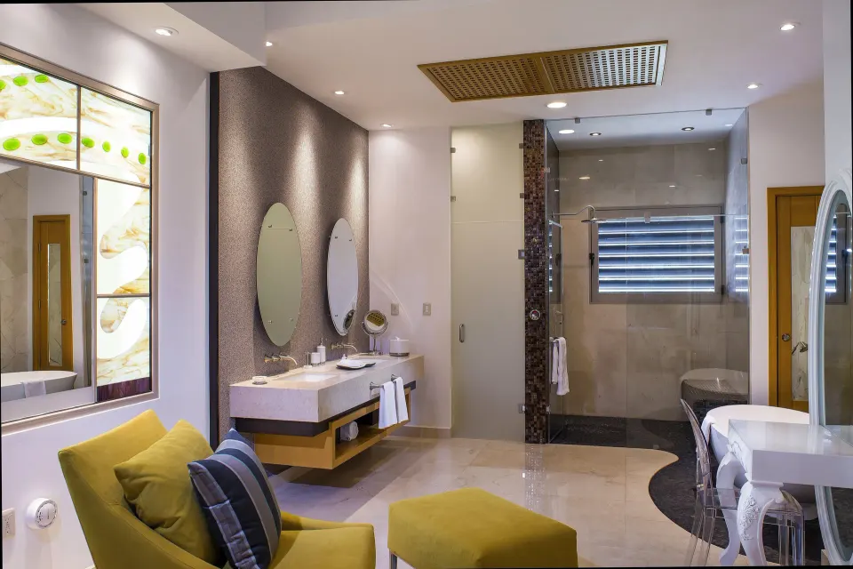 Grand Penthouse bathroom with shower and vanity at Garza Blanca Preserve Resort & Spa.