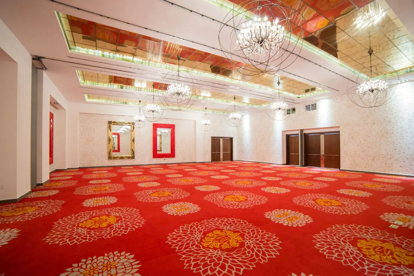 Large red-carpeted event ballroom at Garza Blanca Preserve Resort & Spa.