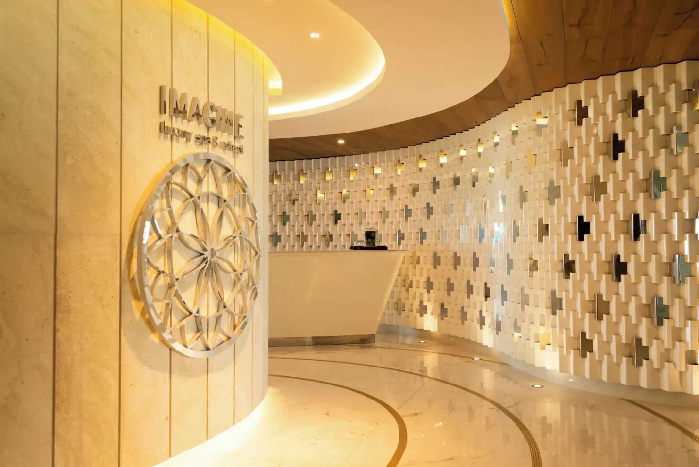 Imagine Spa reception desk and decorative wall at Garza Blanca Resort & Spa Cancun.