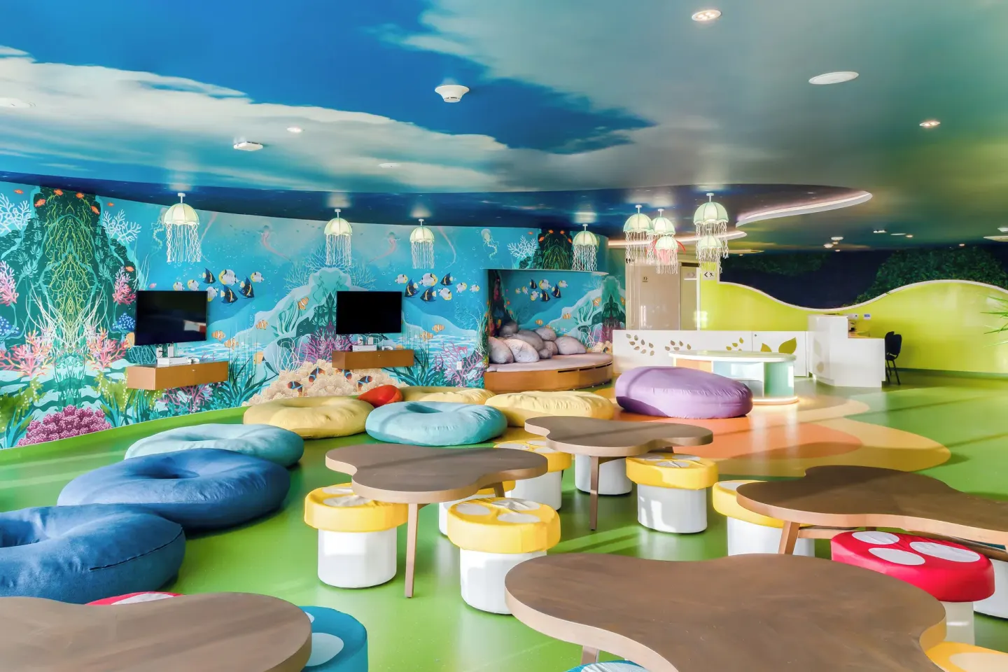 Colorful kids club playroom with ocean murals at Garza Blanca Resort & Spa Cancun.