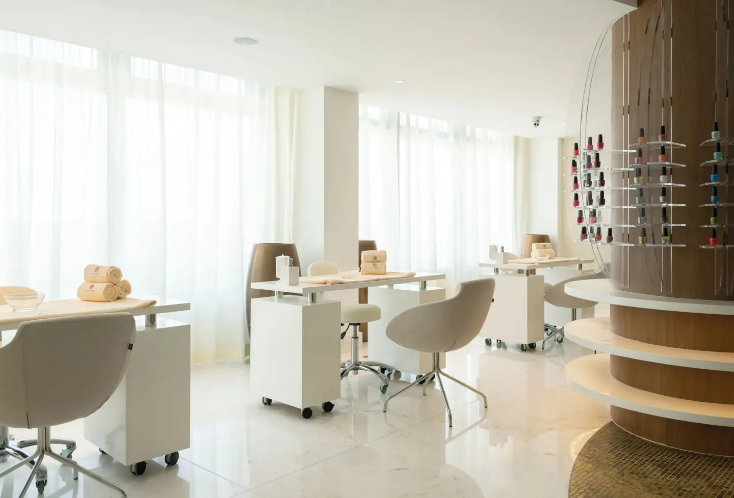 Bright manicure stations with nail polish display at Garza Blanca Resort & Spa Cancun.