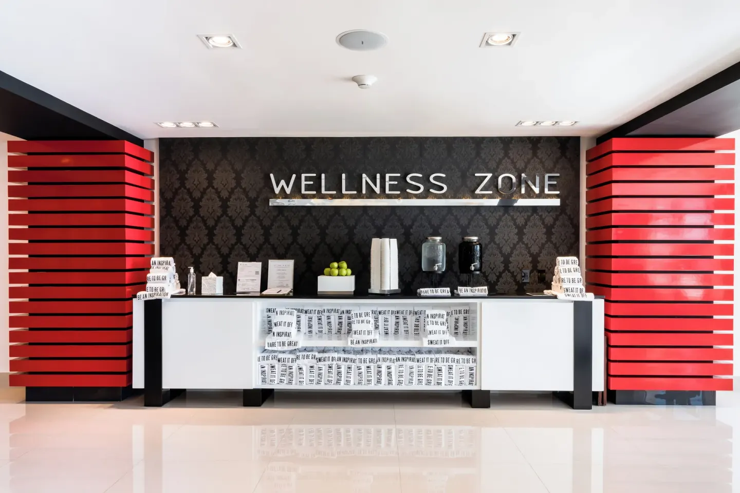 Wellness Zone counter with towels, apples, and drinks at Garza Blanca Resort & Spa Cancun.