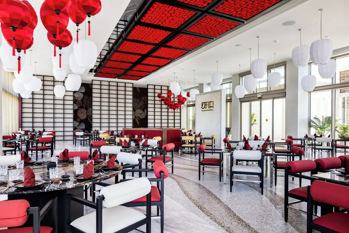 DAO dining room with red accents and lanterns at Garza Blanca Resort & Spa Cancun.
