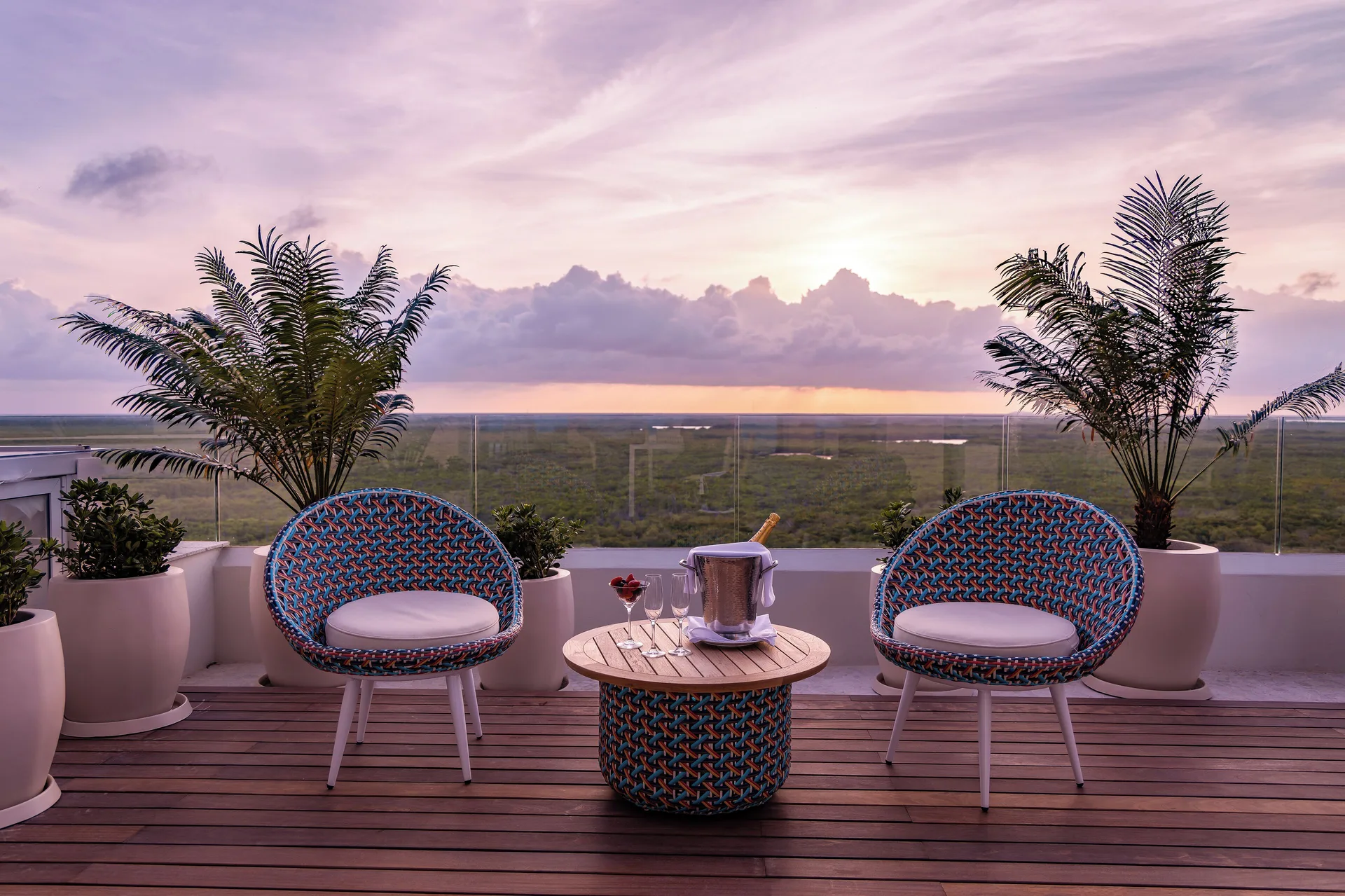 Rooftop terrace seating at sunset at Garza Blanca Resort & Spa Cancun.