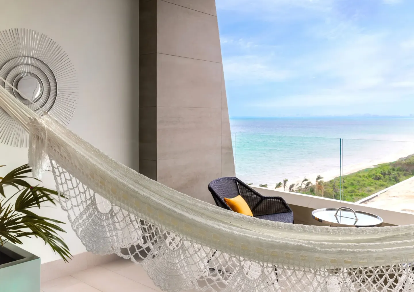 Junior Suite Ocean View balcony hammock overlooking the sea at Garza Blanca Resort & Spa Cancun.