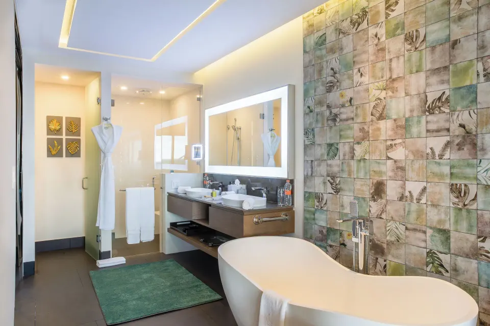 Junior Suite Ocean View bathroom with tub and double vanity at Garza Blanca Resort & Spa Cancun.