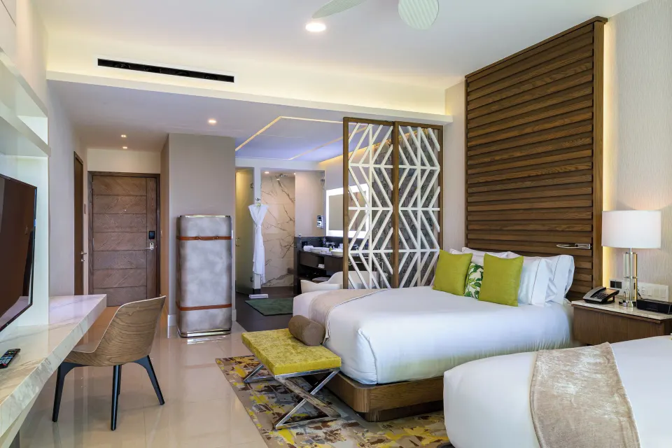 Junior Suite Ocean View with king bed, desk, and open bath at Garza Blanca Resort & Spa Cancun.
