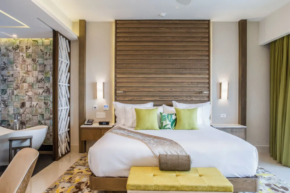 Junior Suite Ocean View king bed and open bath at Garza Blanca Resort & Spa Cancun.