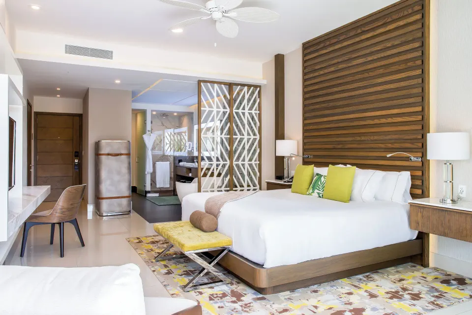 Junior Suite king bed and entry area at Garza Blanca Resort & Spa Cancun.
