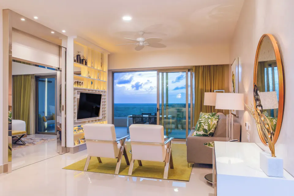 One Bedroom Suite living room with balcony ocean view at Garza Blanca Resort & Spa Cancun.