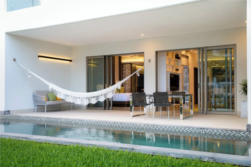 One Bedroom Swim Up terrace with hammock and pool at Garza Blanca Resort & Spa Cancun.